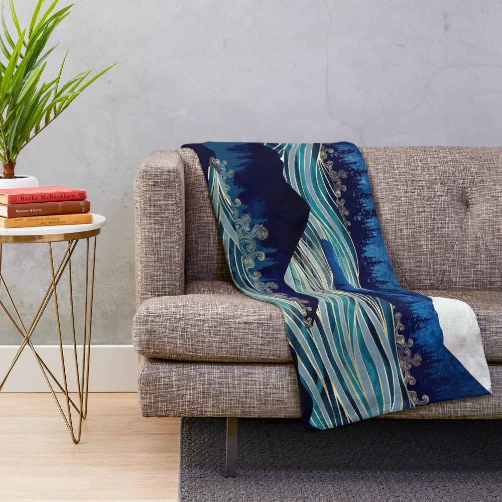 Ocean sunrise-inspired plush blanket with vibrant colors and abstract landscape design