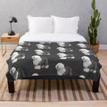 Soft, plush blanket featuring a cute old English sheepdog design