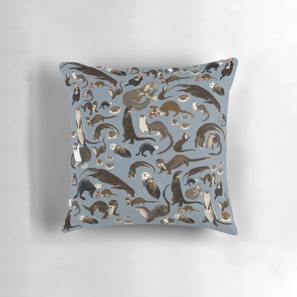 A soft, grey otter pattern pillow featuring adorable otters in a whimsical, vintage-inspired design.