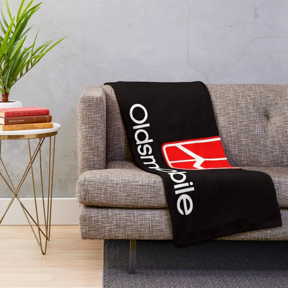 Oldsmobile logo printed on a soft, plush blanket