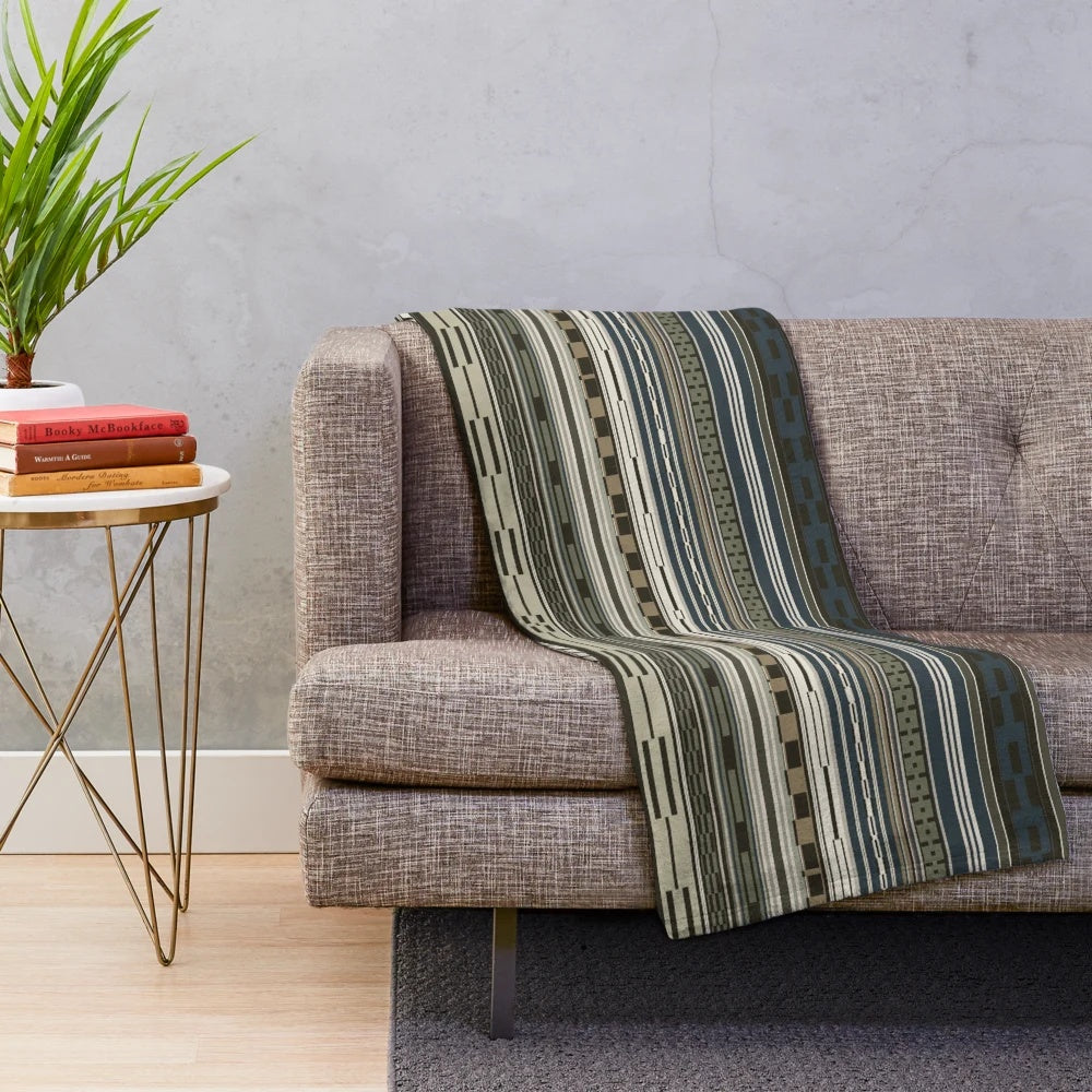 Olive green plush blanket with tribal geometric pattern, ideal for cozy home decor