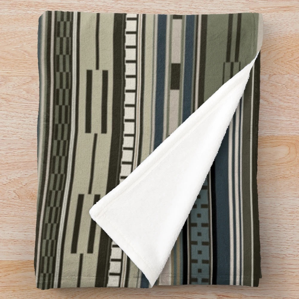 Olive green plush blanket with tribal geometric pattern, ideal for cozy home decor