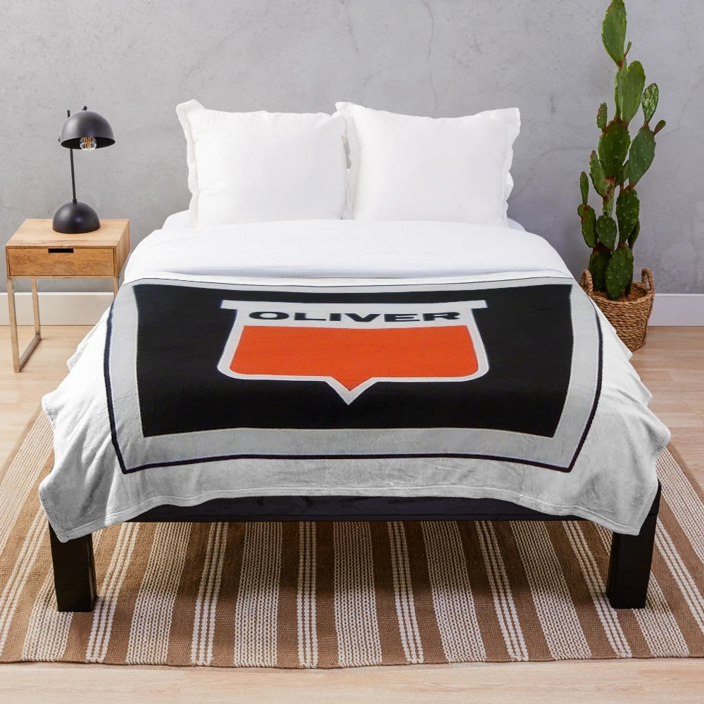 Oliver Tractor Keystone Plush Blanket featuring a detailed tractor design