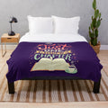 Cozy plush blanket with "One More Chapter" design for book lovers and reading enthusiasts