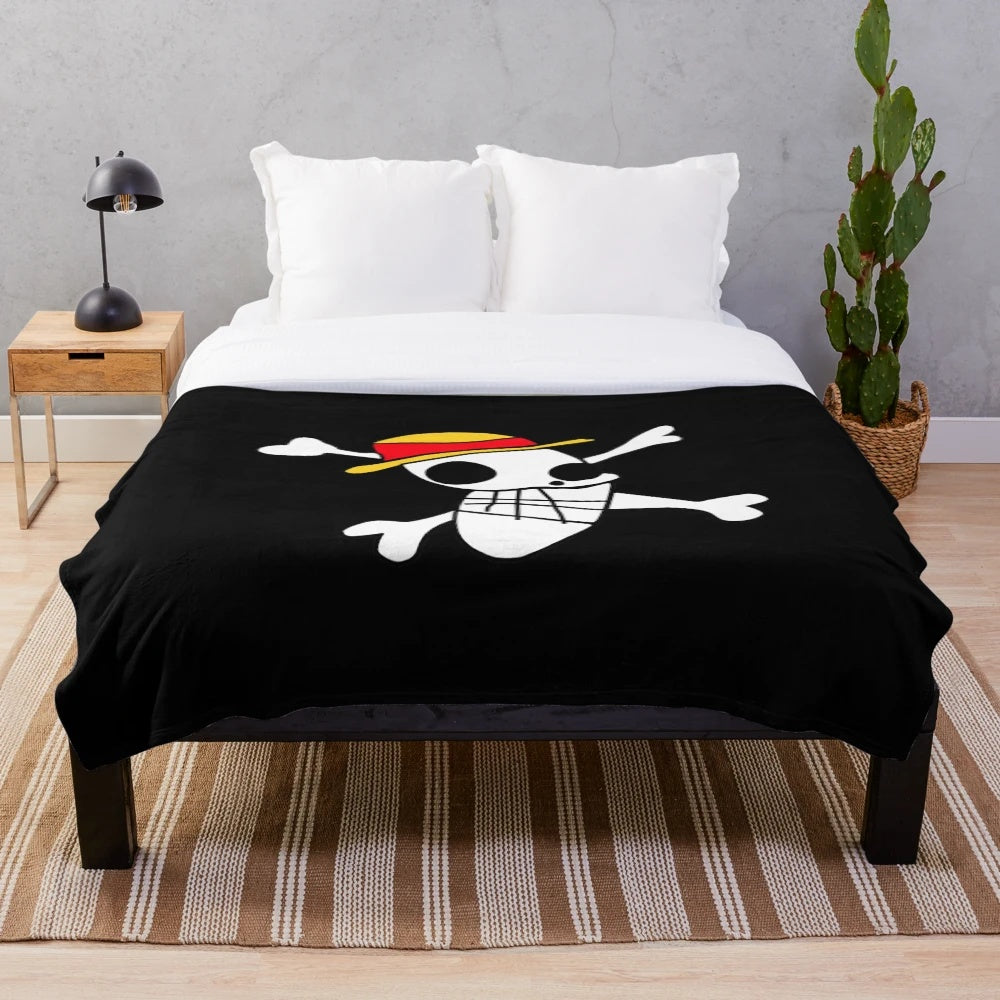 Soft and cuddly plush blanket featuring the iconic Jolly Roger symbol from the anime series One Piece