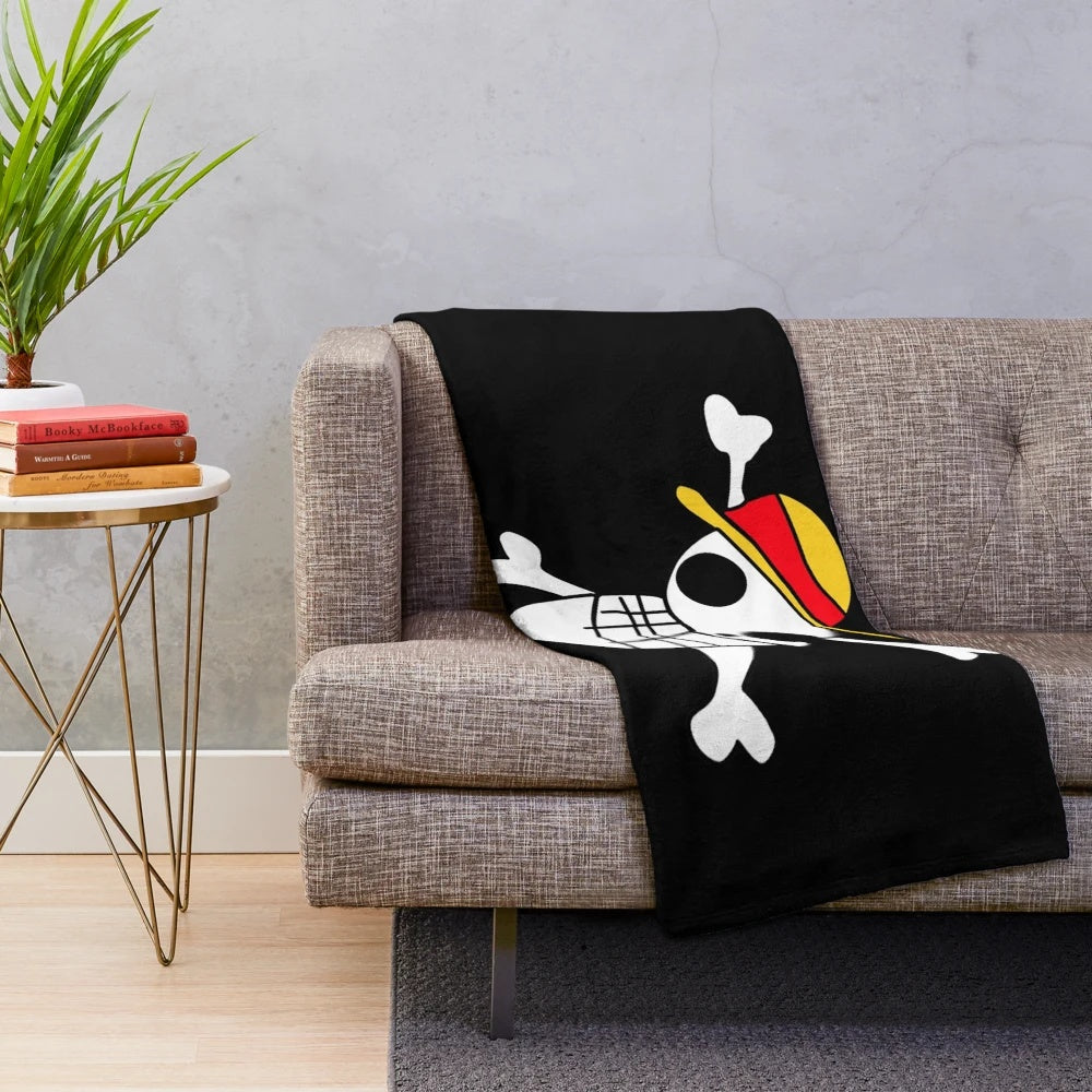 Soft and cuddly plush blanket featuring the iconic Jolly Roger symbol from the anime series One Piece