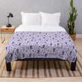 Soft and cuddly plush blanket featuring a cute opossum design in a nature-inspired woodland pattern