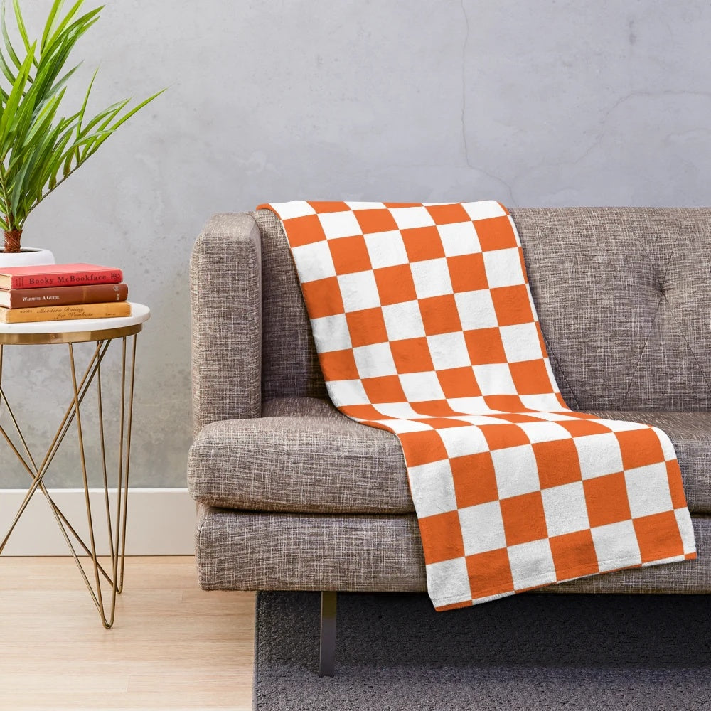Orange and white checkerboard plush blanket with Tennessee Vols design