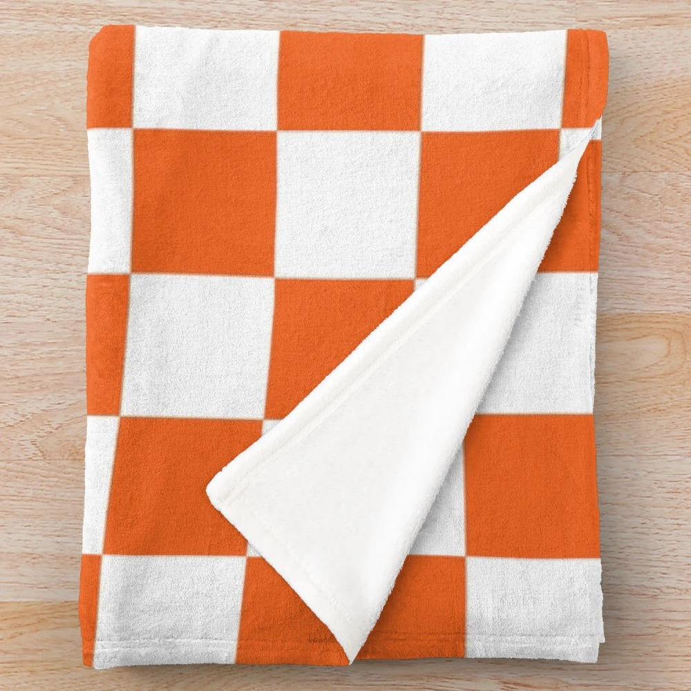 Orange and white checkerboard plush blanket with Tennessee Vols design