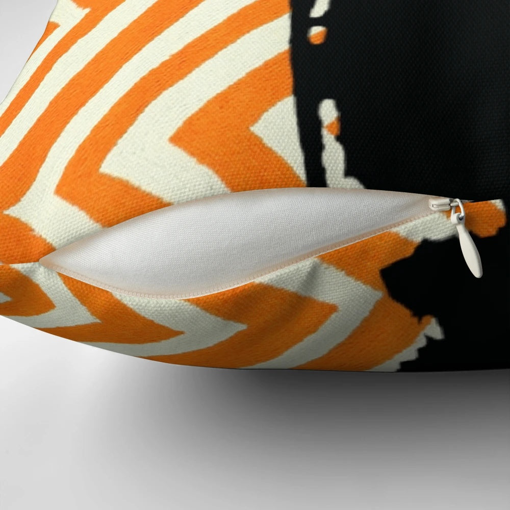 Orange and white chevron patterned plush pillow with a cute bear-like silhouette design