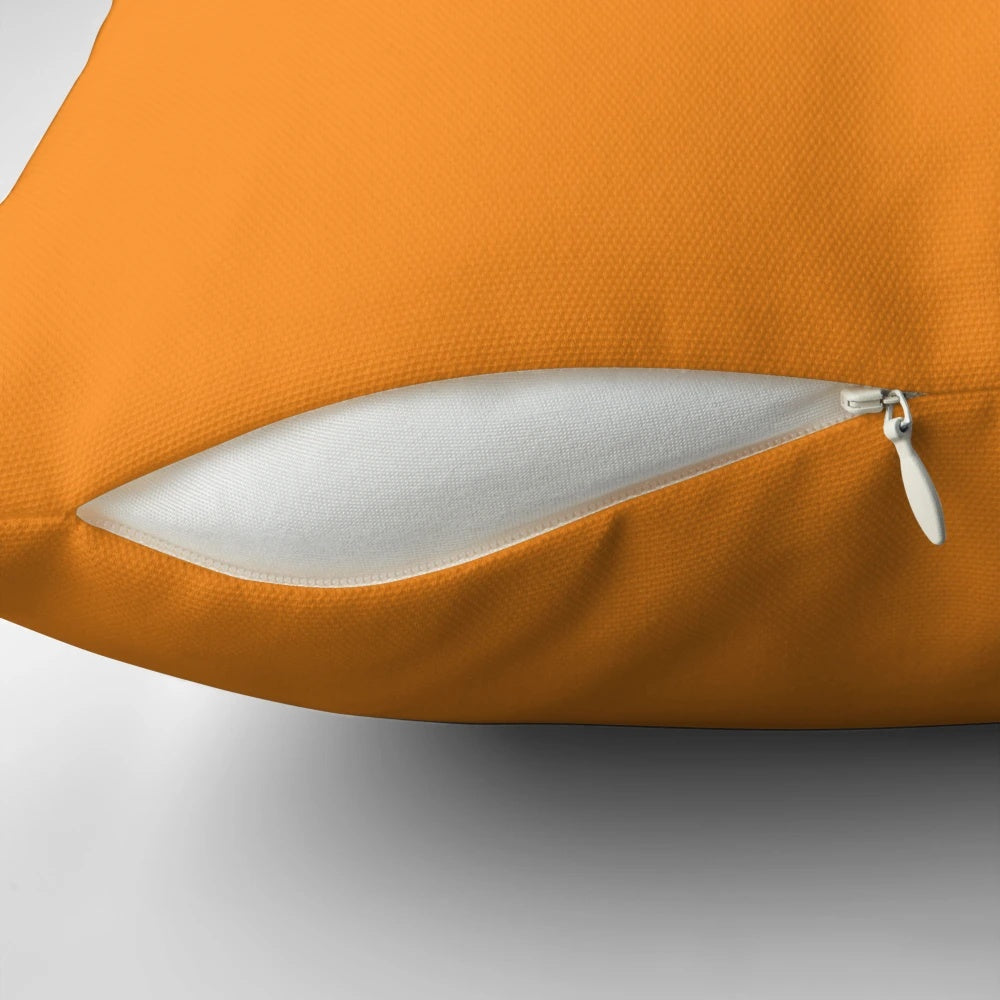 Orange decorative pillow with a soft, plush design for comfortable home accents.