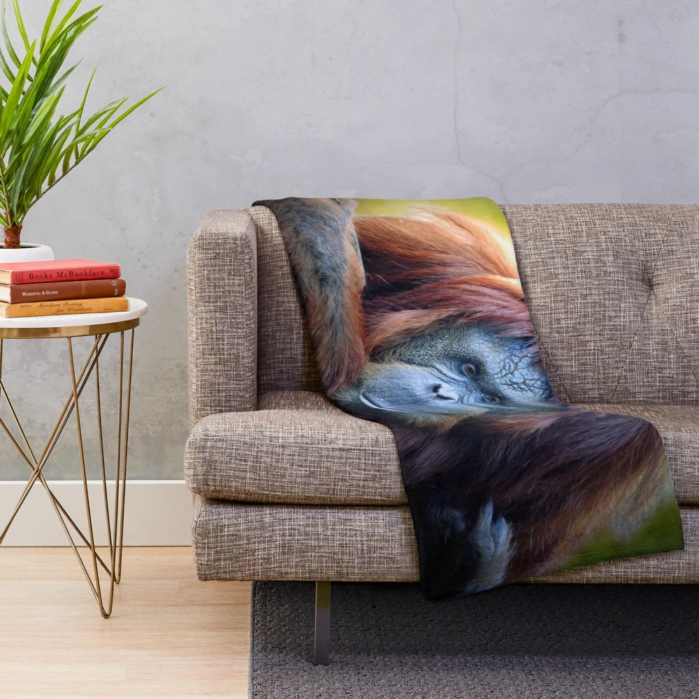 Closeup of an adorable orangutan plush blanket