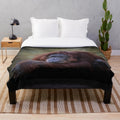 Orangutan plush blanket with a soft, furry design