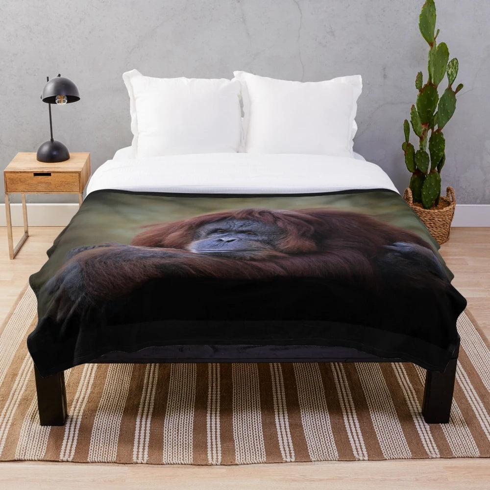 Orangutan plush blanket with a soft, furry design