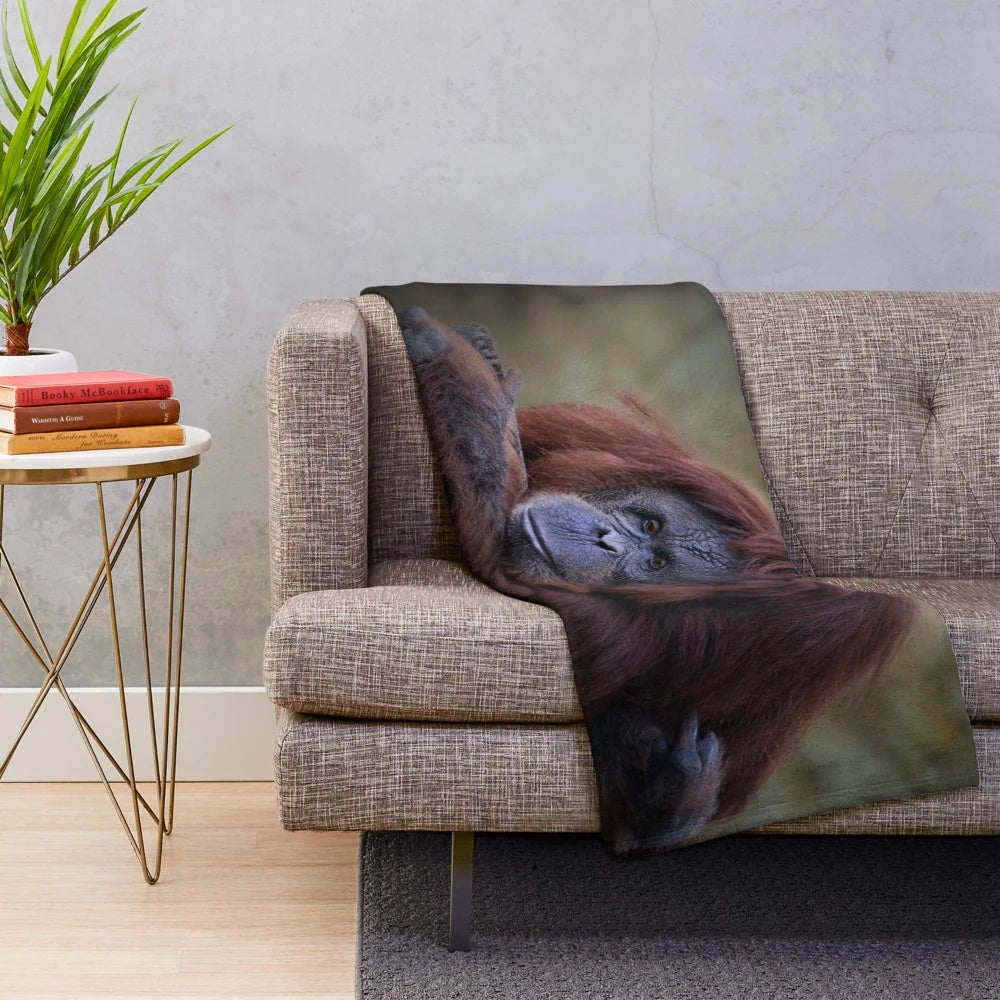 Orangutan plush blanket with a soft, furry design