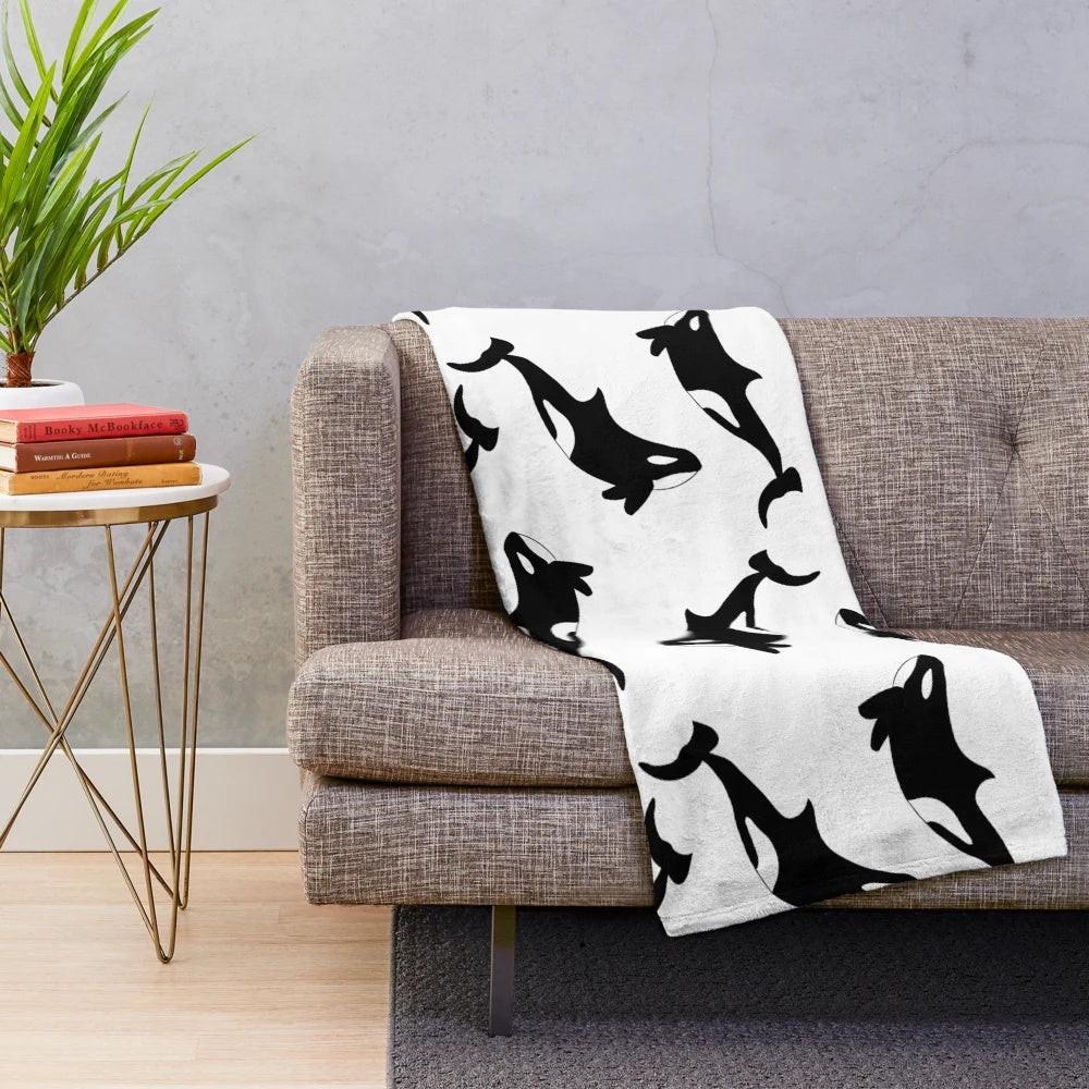 Soft and snuggly orca plush blanket featuring a black and white killer whale design
