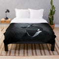 Soft and cuddly orca plush blanket featuring a black and white animal print design