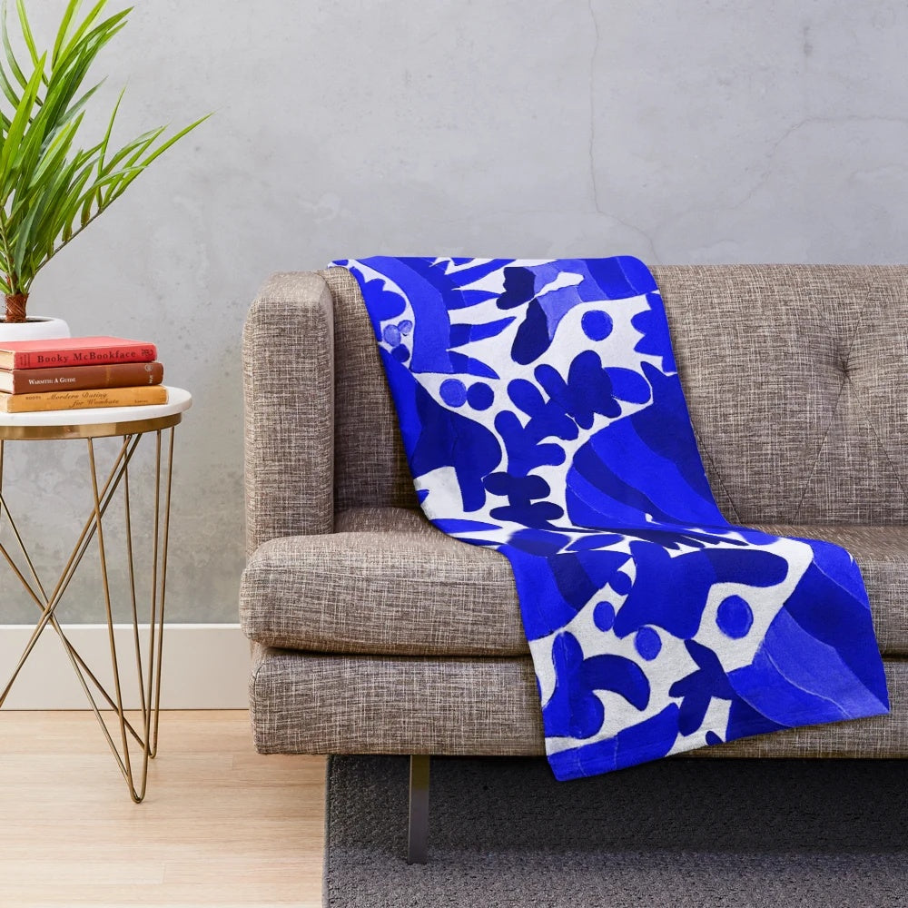 Otomi-inspired dark blue plush blanket with traditional Mexican pattern