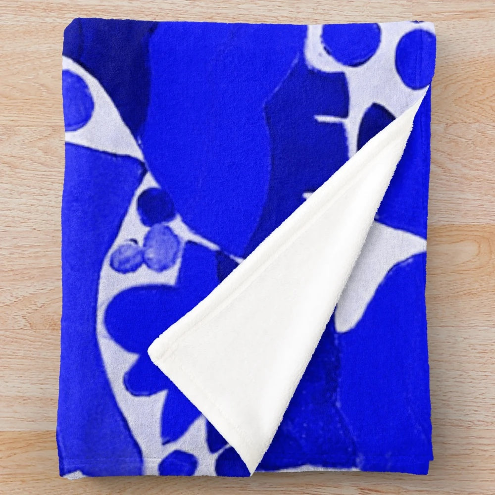 Otomi-inspired dark blue plush blanket with traditional Mexican pattern