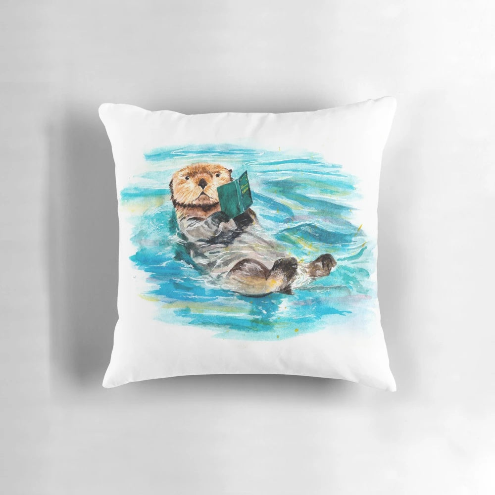 Watercolor illustration of a playful river otter on a plush, decorative otter-themed pillow