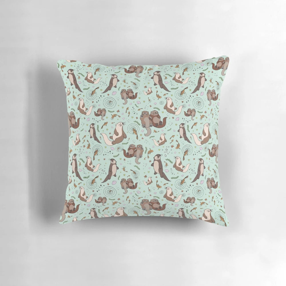 A soft, plush pillow featuring a cute and cozy sea otter design, perfect for otter enthusiasts.