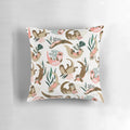 White pillow with a print of a cute sea otter or river otter.