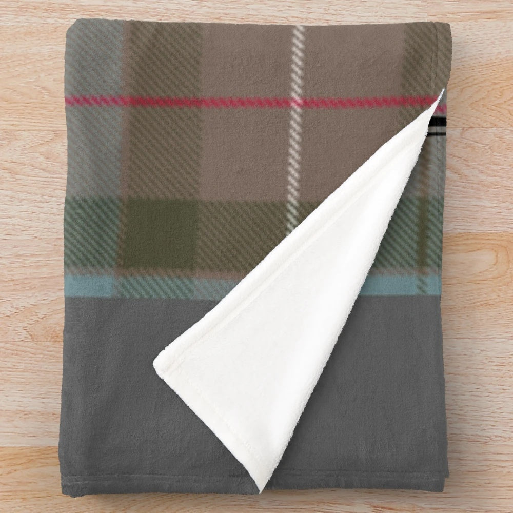 Outlander-themed plush blanket featuring the Clan Fraser tartan and imagery from the popular book and TV series