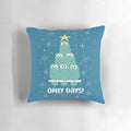A plush, decorative pillow featuring a group of adorable owls in a winter scene