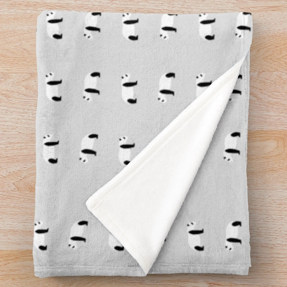 Panda pattern plush blanket in gray, black, and white colors