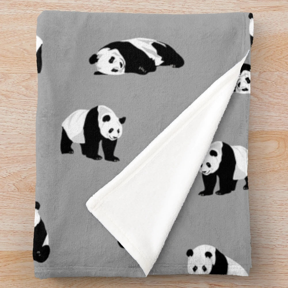 Soft and cuddly grey plush blanket featuring adorable pandas