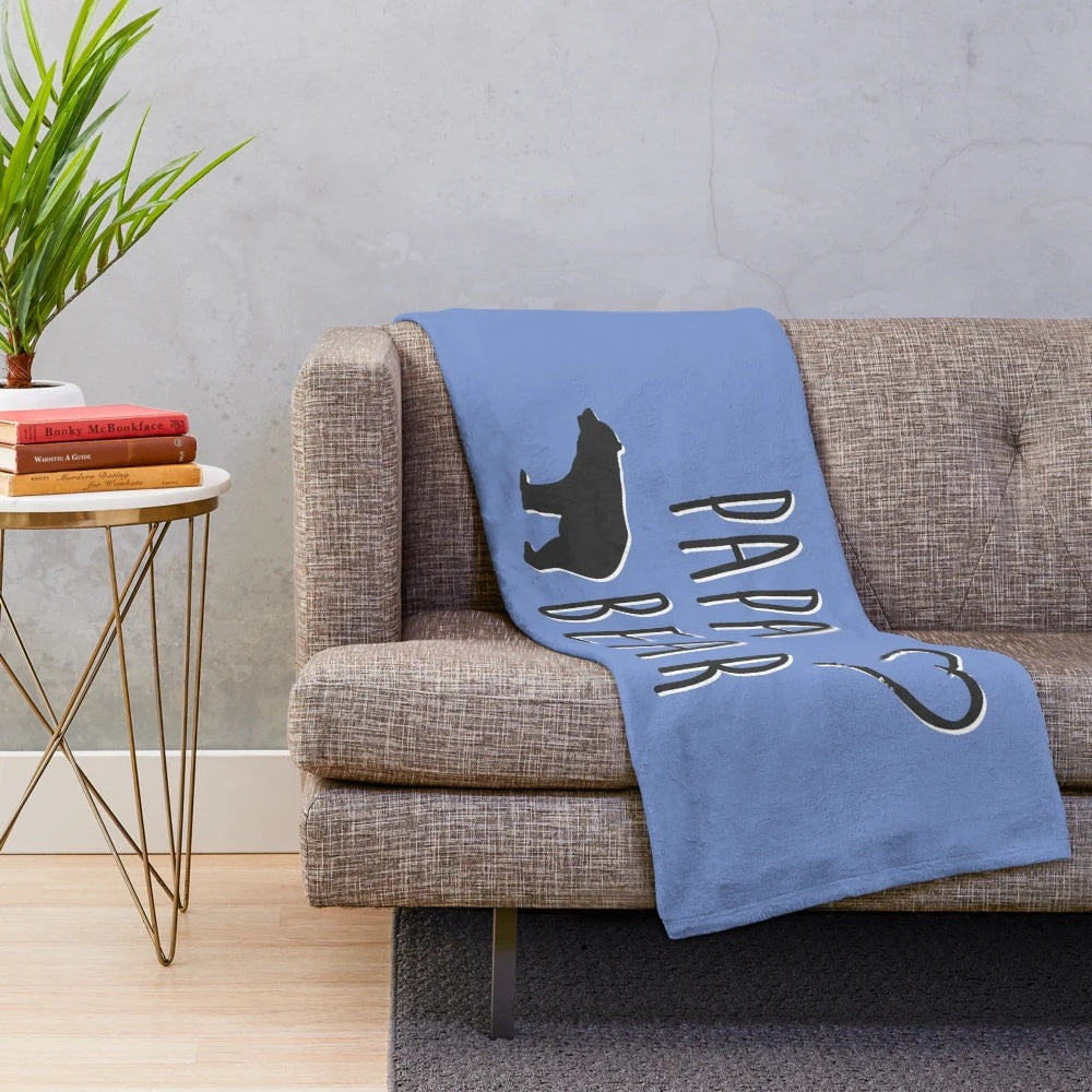 Soft and comfortable plush blanket featuring a papa bear design