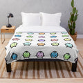 Pastel Junimos plush blanket featuring pixel art from the game Stardew Valley