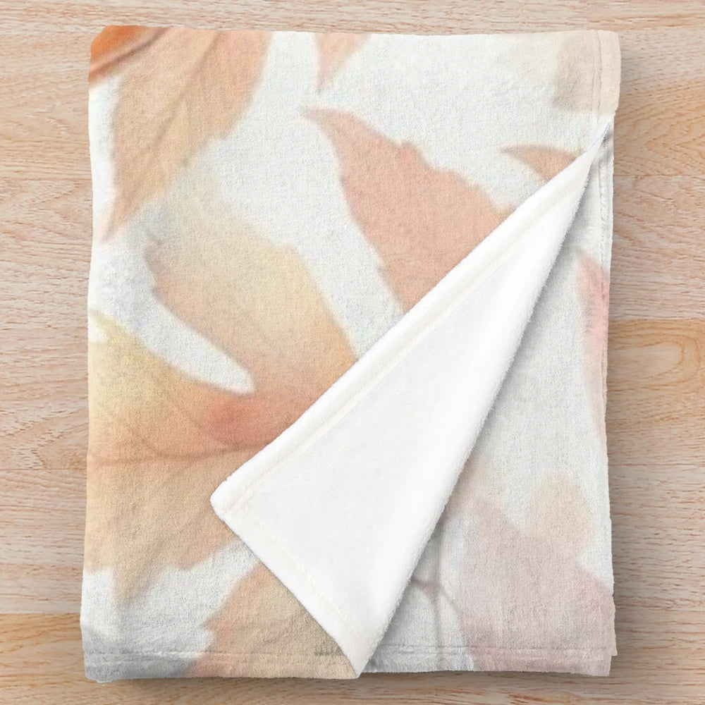 Pastel pumpkin plush blanket with black bow detail