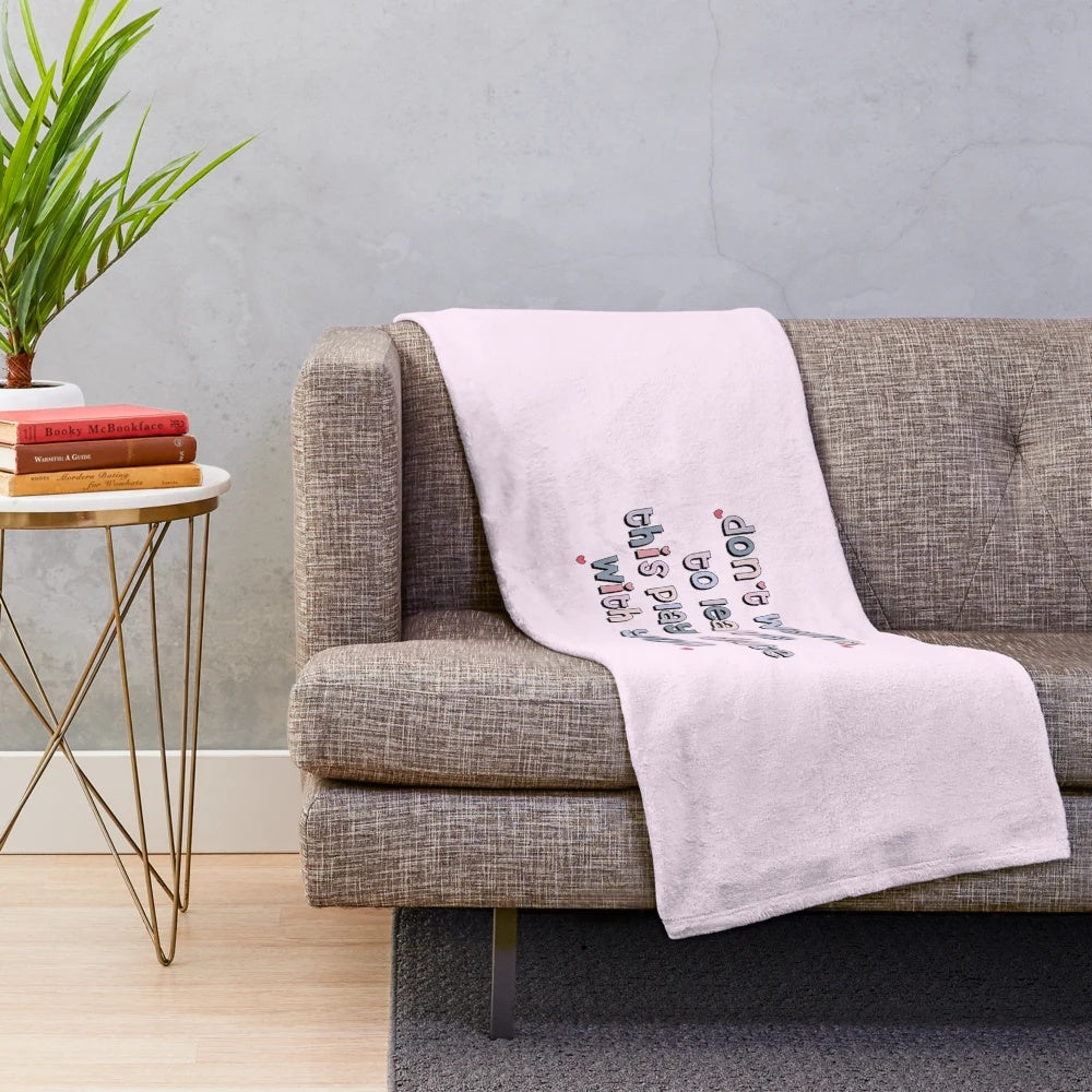 Plush blanket with pastel colors, text, and typography design