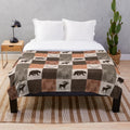 Patchwork blanket with rustic woodland and nature-inspired design