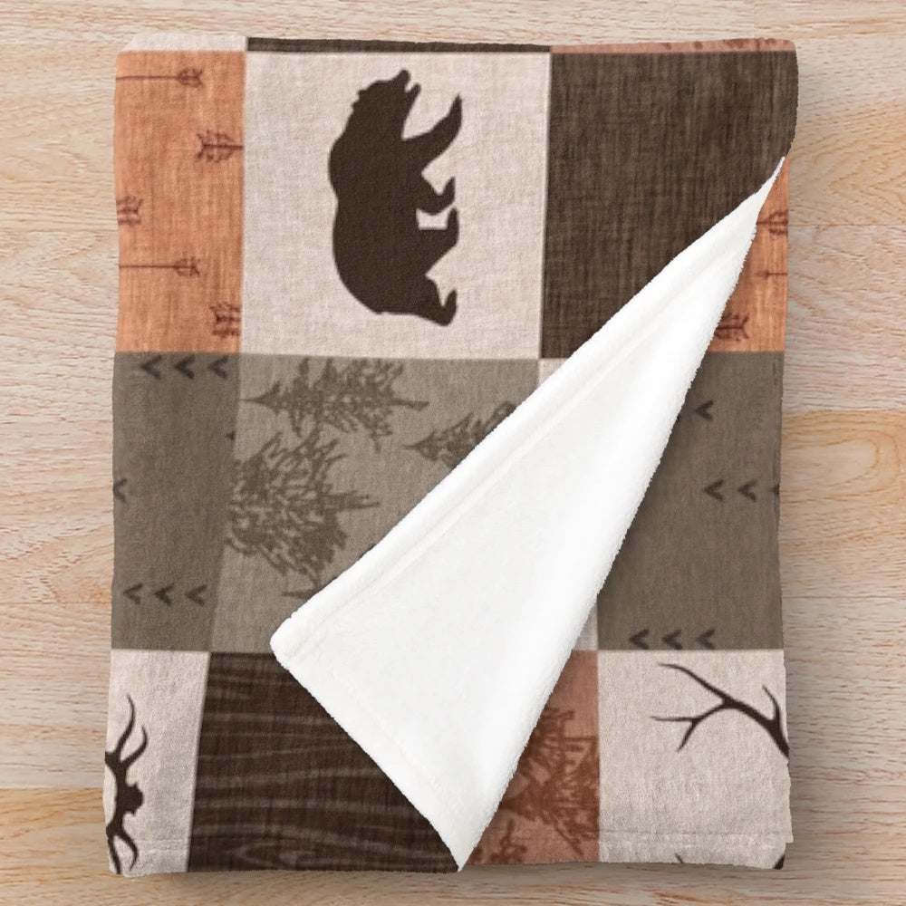 Patchwork blanket with rustic woodland and nature-inspired design
