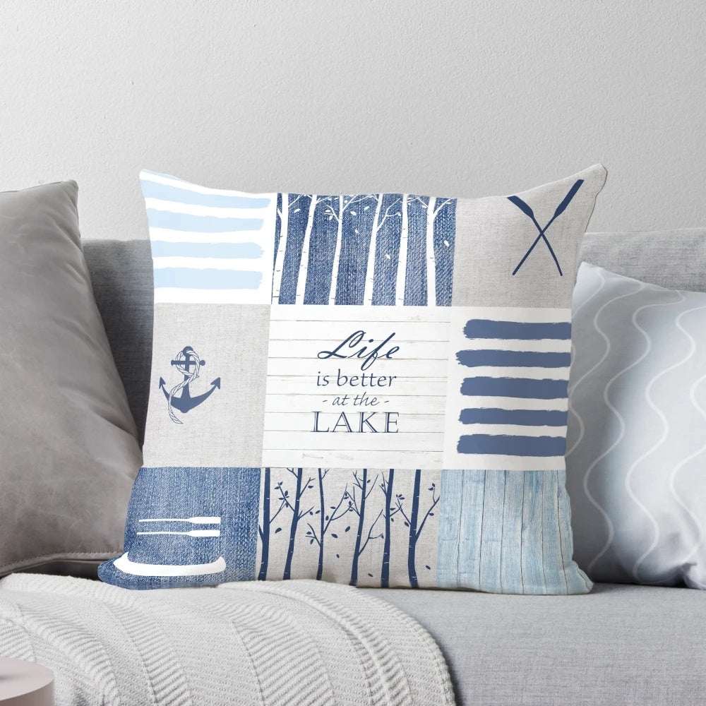 Patchwork pillow with lake, cabin, and water sports design