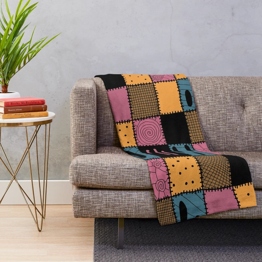Cozy patchwork plush blanket with a spooky Nightmare Sally inspired pattern