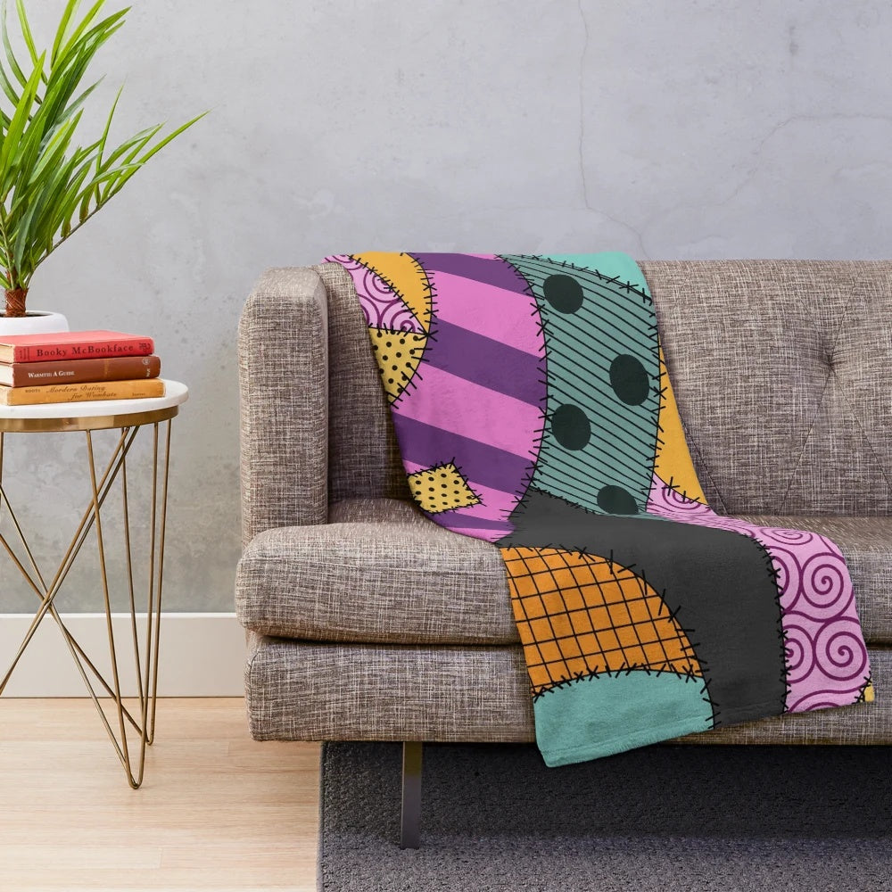 Cozy patchwork Sally ragdoll plush blanket featuring stitched design inspired by The Nightmare Before Christmas