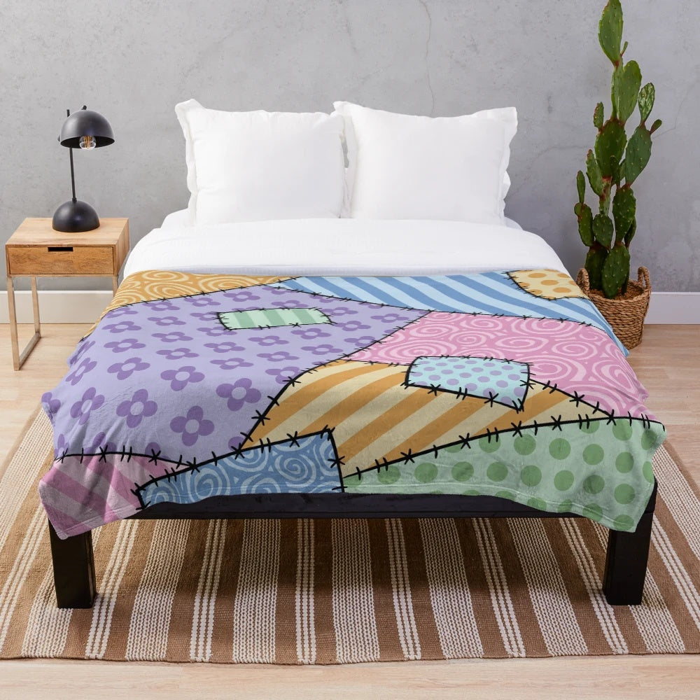 Colorful patchwork throw blanket with star and floral patterns