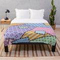 Colorful patchwork throw blanket with star and floral patterns