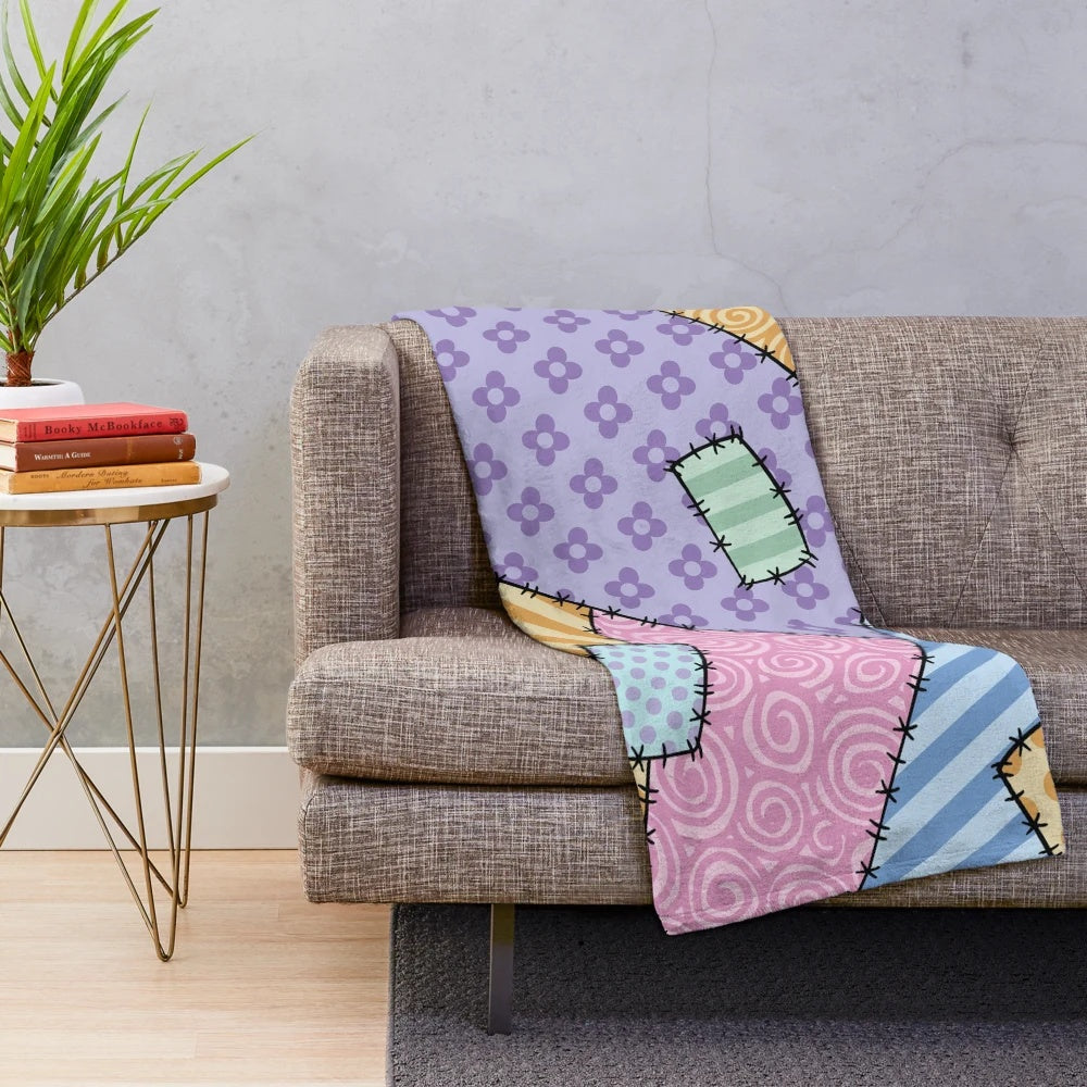 Colorful patchwork throw blanket with star and floral patterns