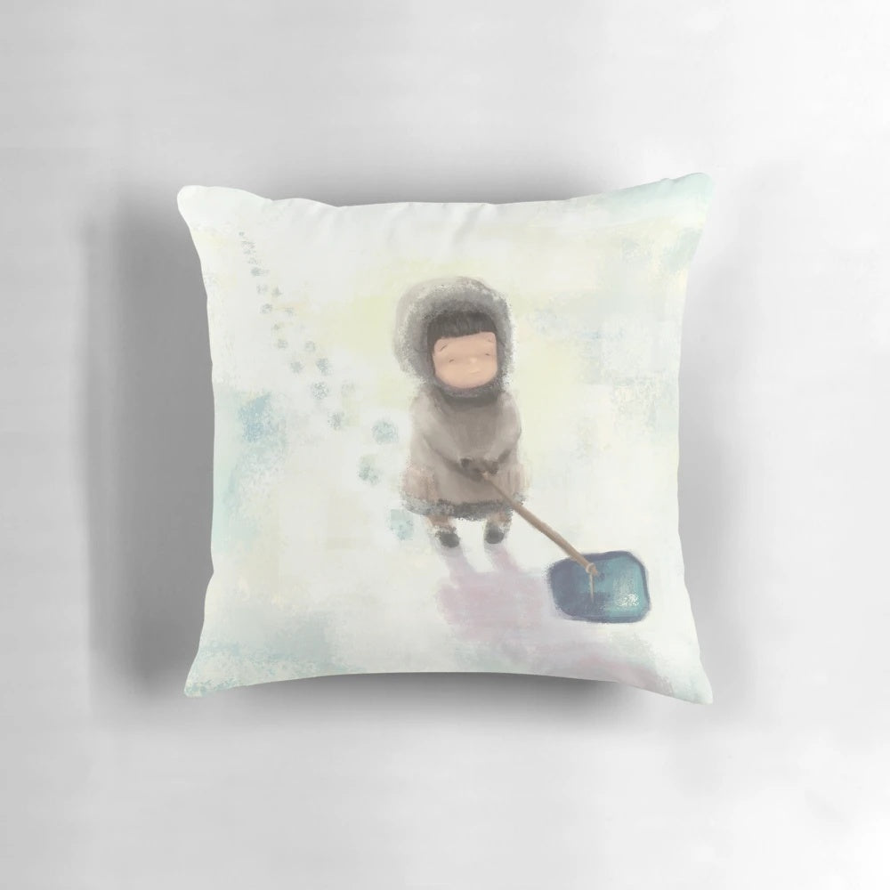 Patience Pillow featuring an illustration of Inuit children fishing in a snowy, Arctic landscape