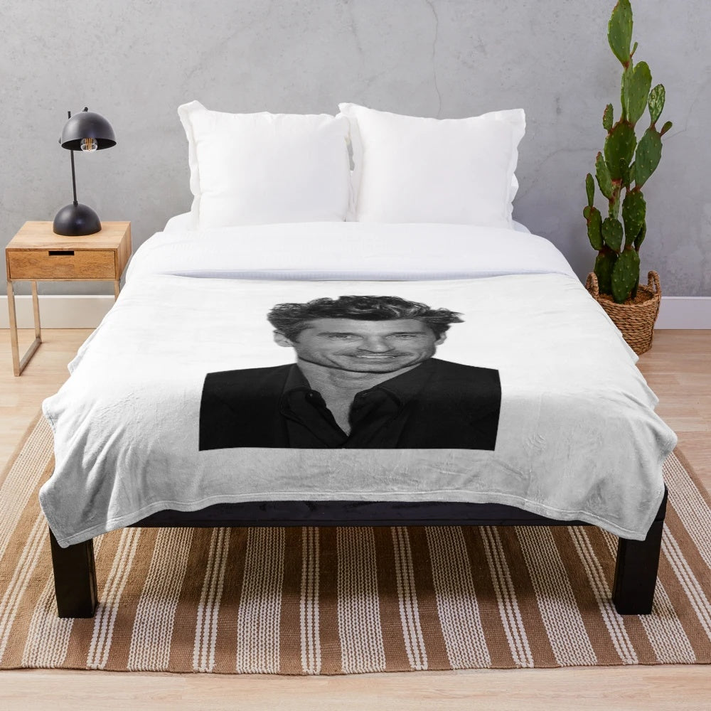 Patrick Dempsey as Derek Shepherd on a plush blanket