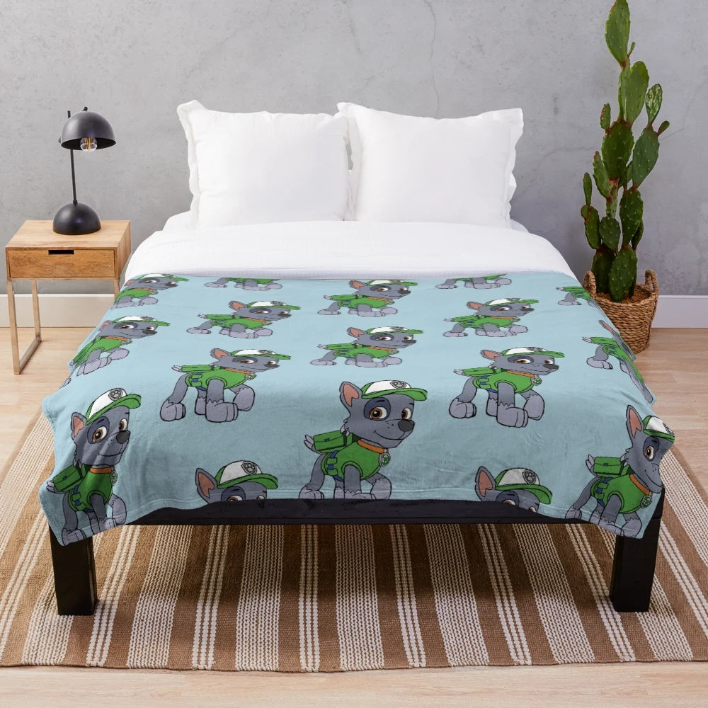 Soft and cozy plush blanket featuring the Paw Patrol character Rocky