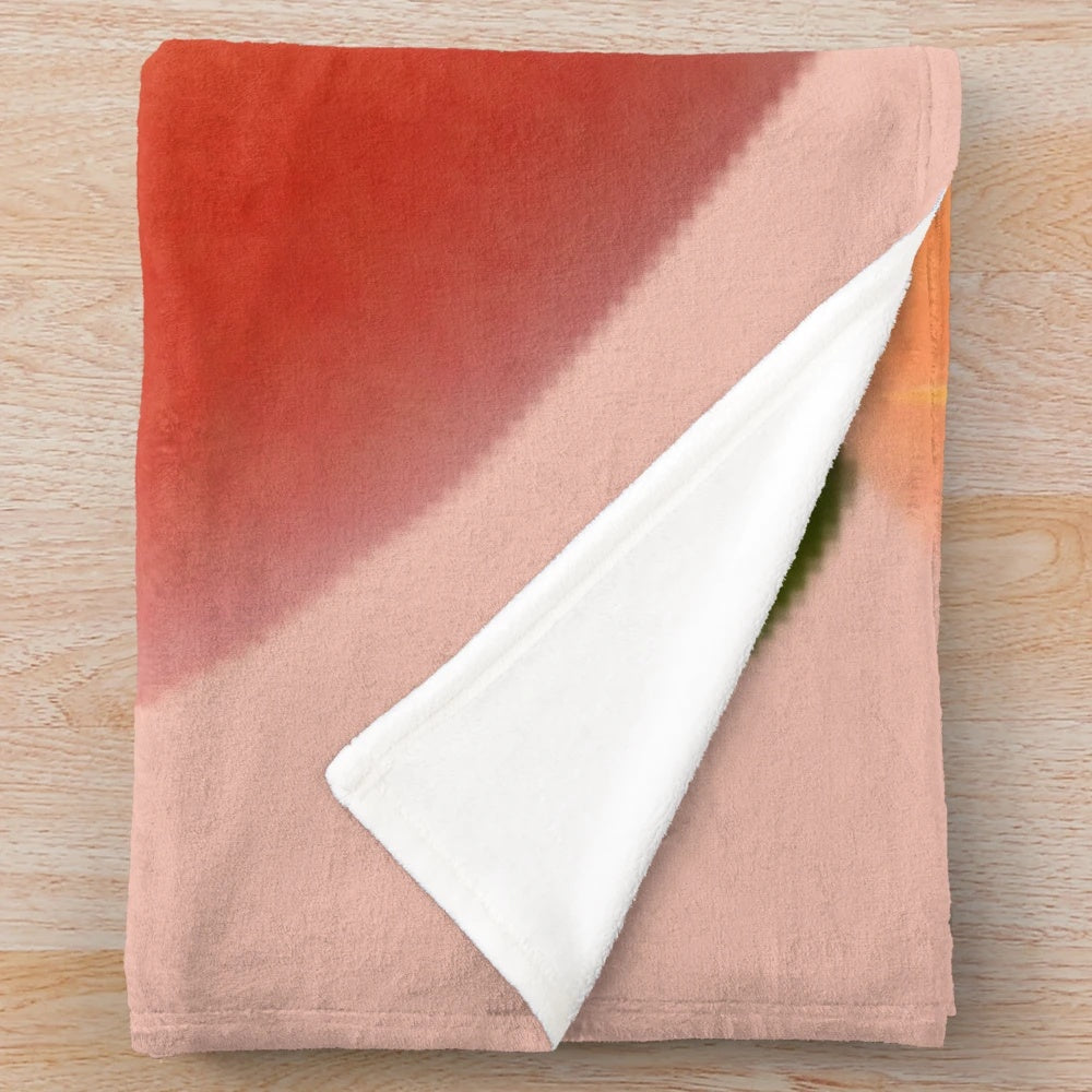 Peach plush blanket with a playful peach emoji design