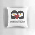 A cuddly black and white penguin pillow with a red heart, showcasing a romantic love quote