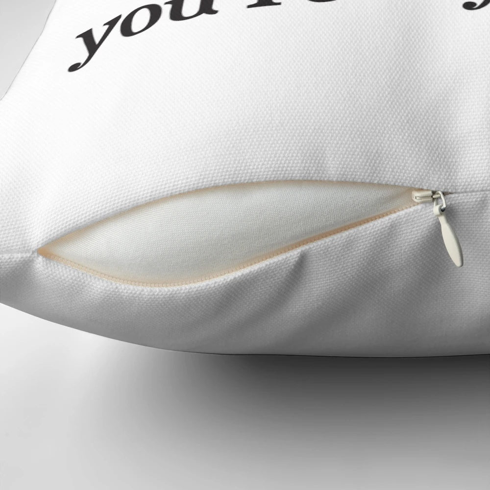 A cuddly black and white penguin pillow with a red heart, showcasing a romantic love quote