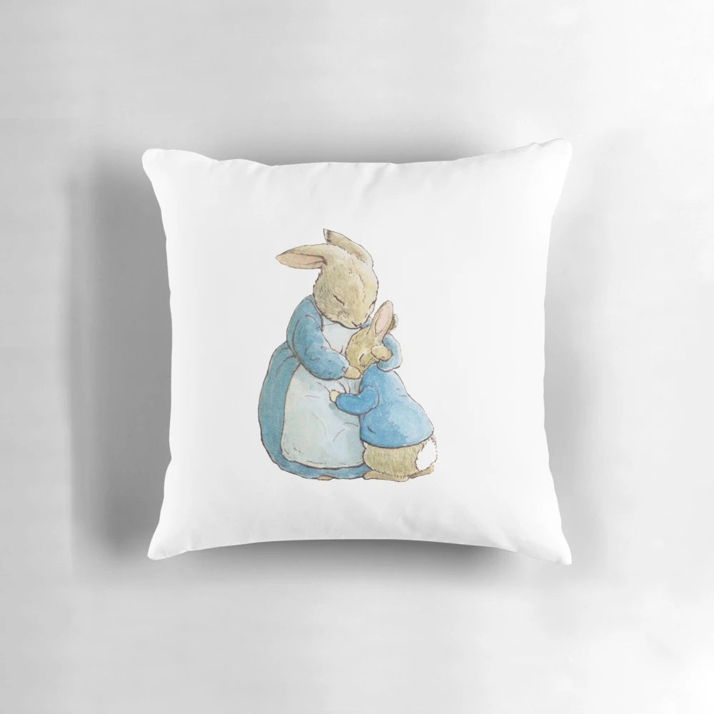 A soft, plush pillow featuring the iconic Peter Rabbit character from Beatrix Potter's timeless children's stories.