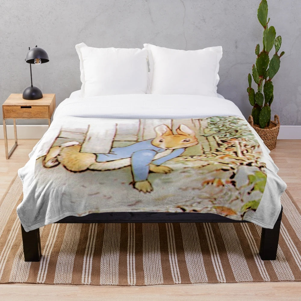 Soft and cuddly plush blanket featuring the iconic character Peter Rabbit from Beatrix Potter's classic children's stories